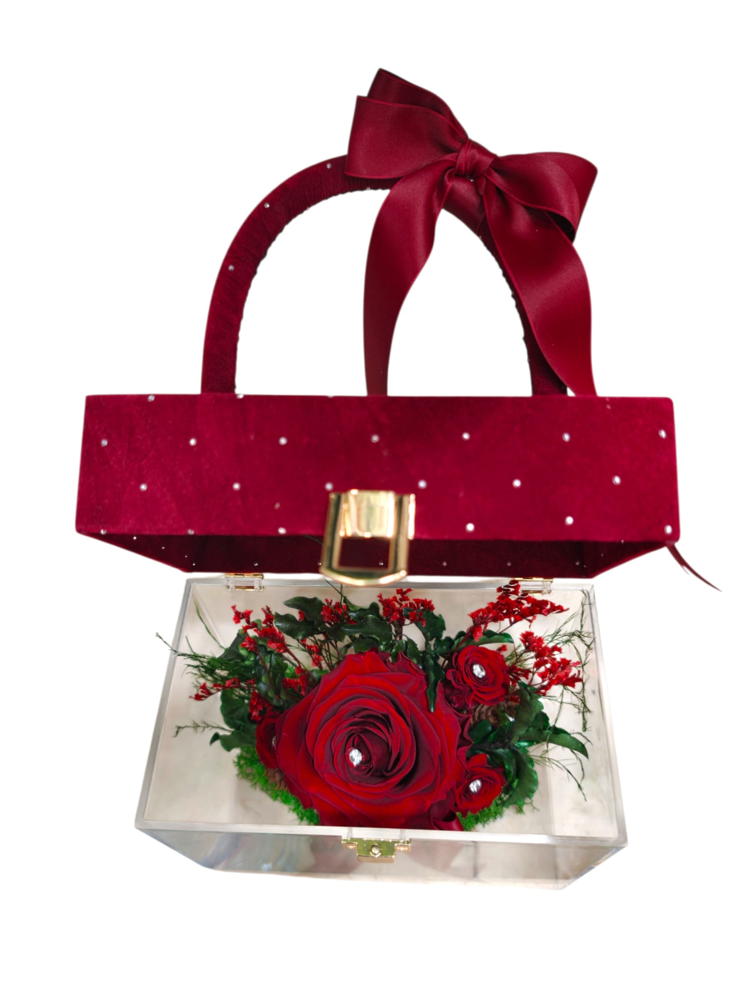 Borsa decorativa rossa chiusa con rose stabilizzate visibili attraverso la parte trasparente